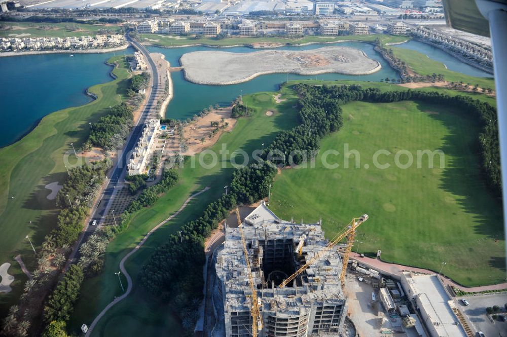 Aerial photograph Ras Al Khaimah - Complex and construction site of the Al Hamra Fort Hotel & Beach Resort in the arab emirate Ras Al Khaimah. The complex is part of the construction project Al Hamra Village which is realized by the state-owned company Al Hamra Real Estate