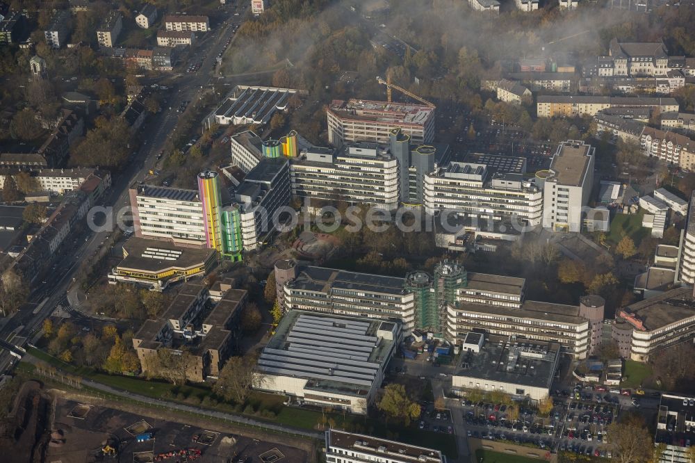 Aerial image Essen - View of buildings on the Essen campus of the University Duisburg-Essen with its landmark, the colourfull towers lighthouses of education in the state North Rhine-Westphalia. Visible is the construction site for the roation building, to be used by multiple university institutions