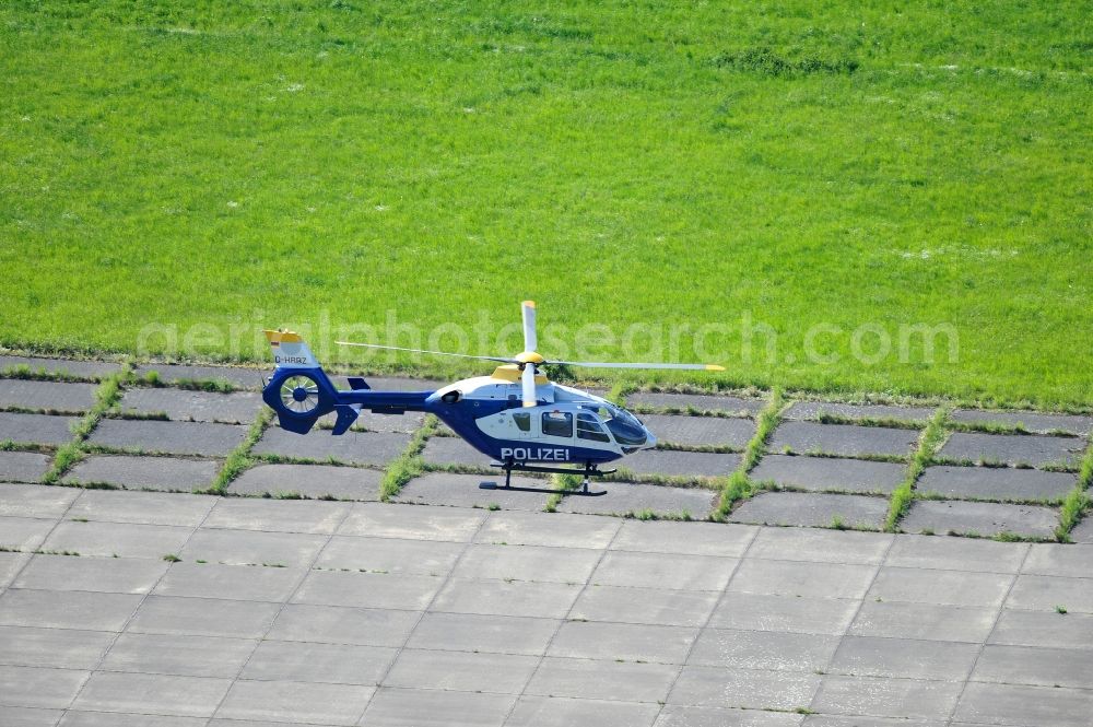 Aerial photograph Werneuchen - View one just above the runway / runway of the airfield Werneuchen floating Eurocopter with the registration D-HBBZ the Federal Police