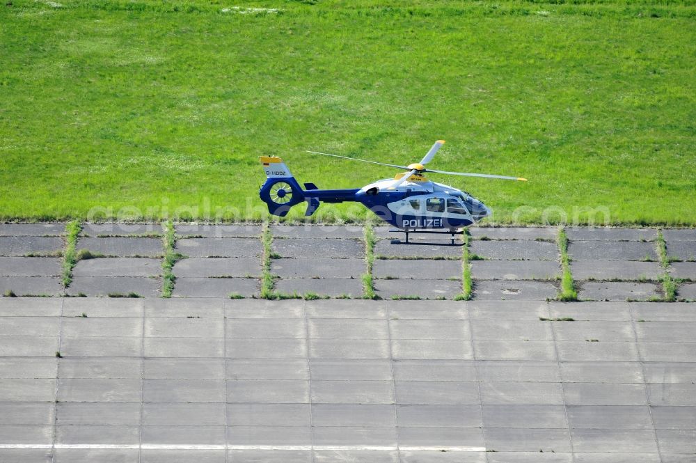 Aerial image Werneuchen - View one just above the runway / runway of the airfield Werneuchen floating Eurocopter with the registration D-HBBZ the Federal Police