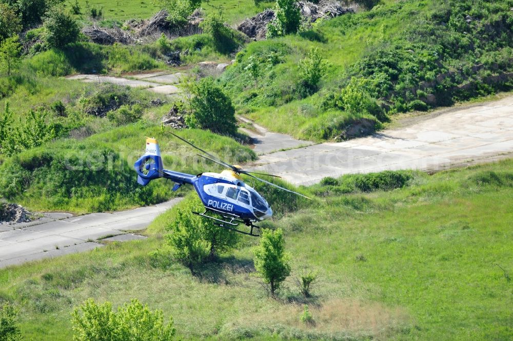 Werneuchen from above - View one just above the runway / runway of the airfield Werneuchen floating Eurocopter with the registration D-HBBZ the Federal Police