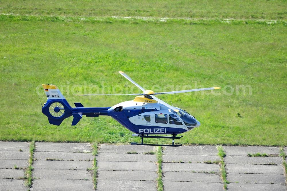 Werneuchen from above - View one just above the runway / runway of the airfield Werneuchen floating Eurocopter with the registration D-HBBZ the Federal Police