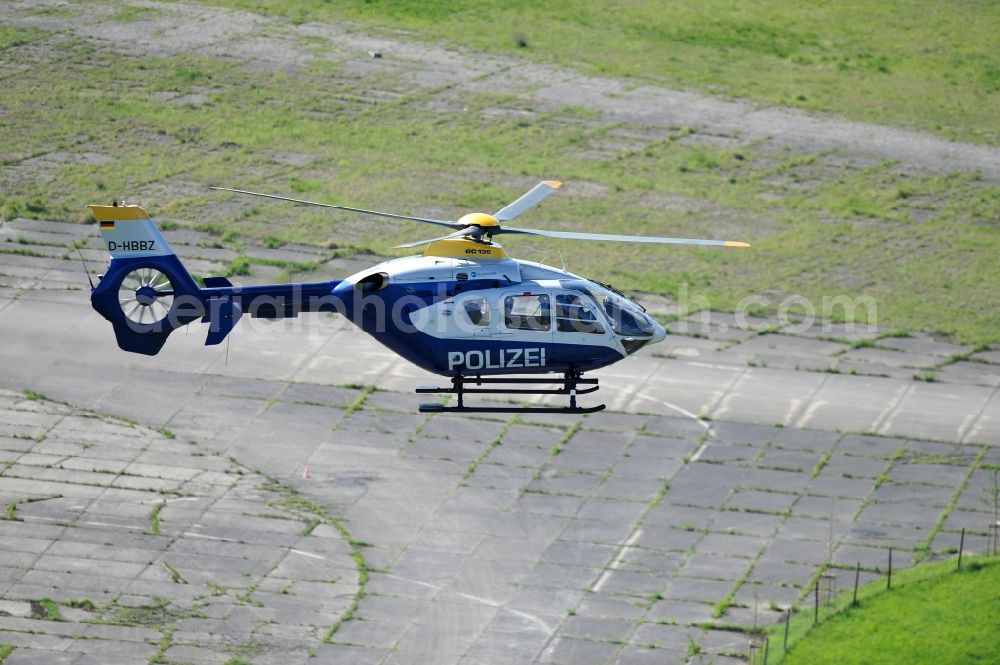 Werneuchen from above - View one just above the runway / runway of the airfield Werneuchen floating Eurocopter with the registration D-HBBZ the Federal Police