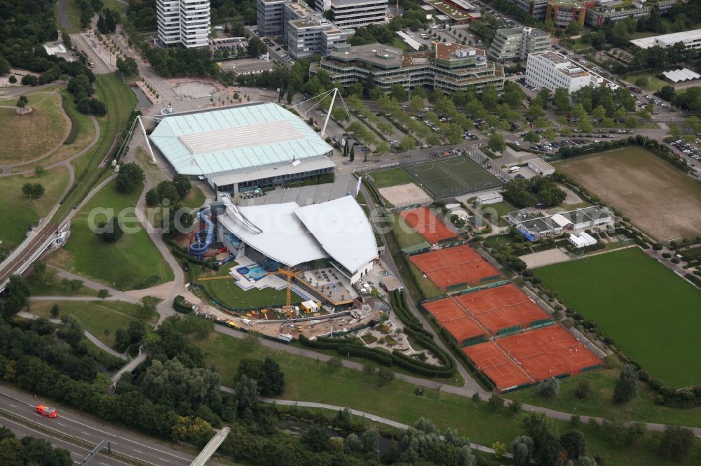 Aerial image Karlsruhe - View of the exhibition and event hall Europahalle in Karlsruhe in Baden-Württemberg. The Europahalle consists of a main hall divided in four pieces witha total capacity of 9000 sats, a running track and athletic areas. The roof engeneering is held by two steel cables. Adjacent to the Europahalle lies the Europabad, a swimming and spa hall