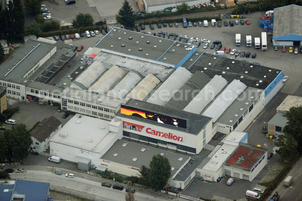 Aerial image Berlin - European headquarters of the Energy- and Battery production company Camelion Batterien GmbH in Berlin in Germany. The company and factory building is located in an industrial area on Grenzallee. It is widely visible because of the luminous advertising