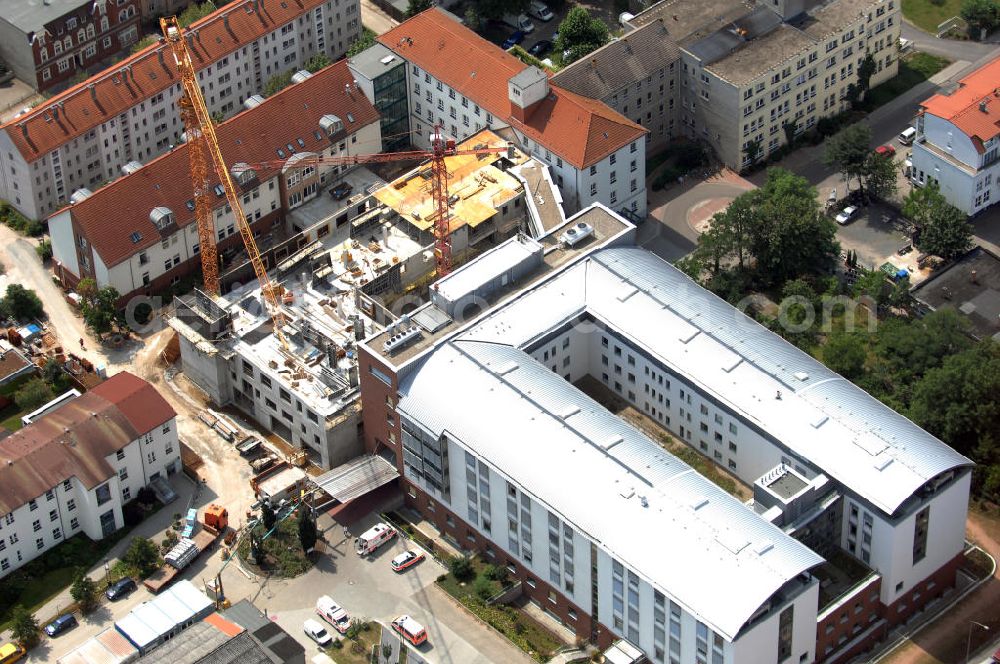 Aerial image Lutherstadt Wittenberg - Blick auf den Erweiterungsbau des Ev. Krankenhaus der Paul-Gerhardt-Stift in Wittenberg. Der Paul-Gerhardt-Stift ist ein Akademisches Lehrkrankenhaus der Martin-Luther-Univeristät Halle-Wittenberg. Der 1876 gegründete Paul-Gerhardt-Stift ist der größte Gesundheitsdienstleister zwischen Berlin und Leipzig. Das Prinzip der Stiftung lautet bestmögliche Pflege alter oder kranker Menschen. Zum 125-jährigen Gründungsjubiläum soll der neue Bauabschnitt eingeweiht werden. Kontakt: Vorstandssekretariat, Paul-Gerhardt-Str. 42-45, 06886 Lutherstadt Wittenberg, Tel.: 03491–502242,