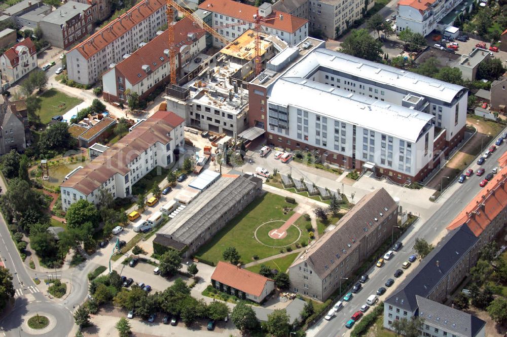 Aerial photograph Lutherstadt Wittenberg - Blick auf den Erweiterungsbau des Ev. Krankenhaus der Paul-Gerhardt-Stift in Wittenberg. Der Paul-Gerhardt-Stift ist ein Akademisches Lehrkrankenhaus der Martin-Luther-Univeristät Halle-Wittenberg. Der 1876 gegründete Paul-Gerhardt-Stift ist der größte Gesundheitsdienstleister zwischen Berlin und Leipzig. Das Prinzip der Stiftung lautet bestmögliche Pflege alter oder kranker Menschen. Zum 125-jährigen Gründungsjubiläum soll der neue Bauabschnitt eingeweiht werden. Kontakt: Vorstandssekretariat, Paul-Gerhardt-Str. 42-45, 06886 Lutherstadt Wittenberg, Tel.: 03491–502242,