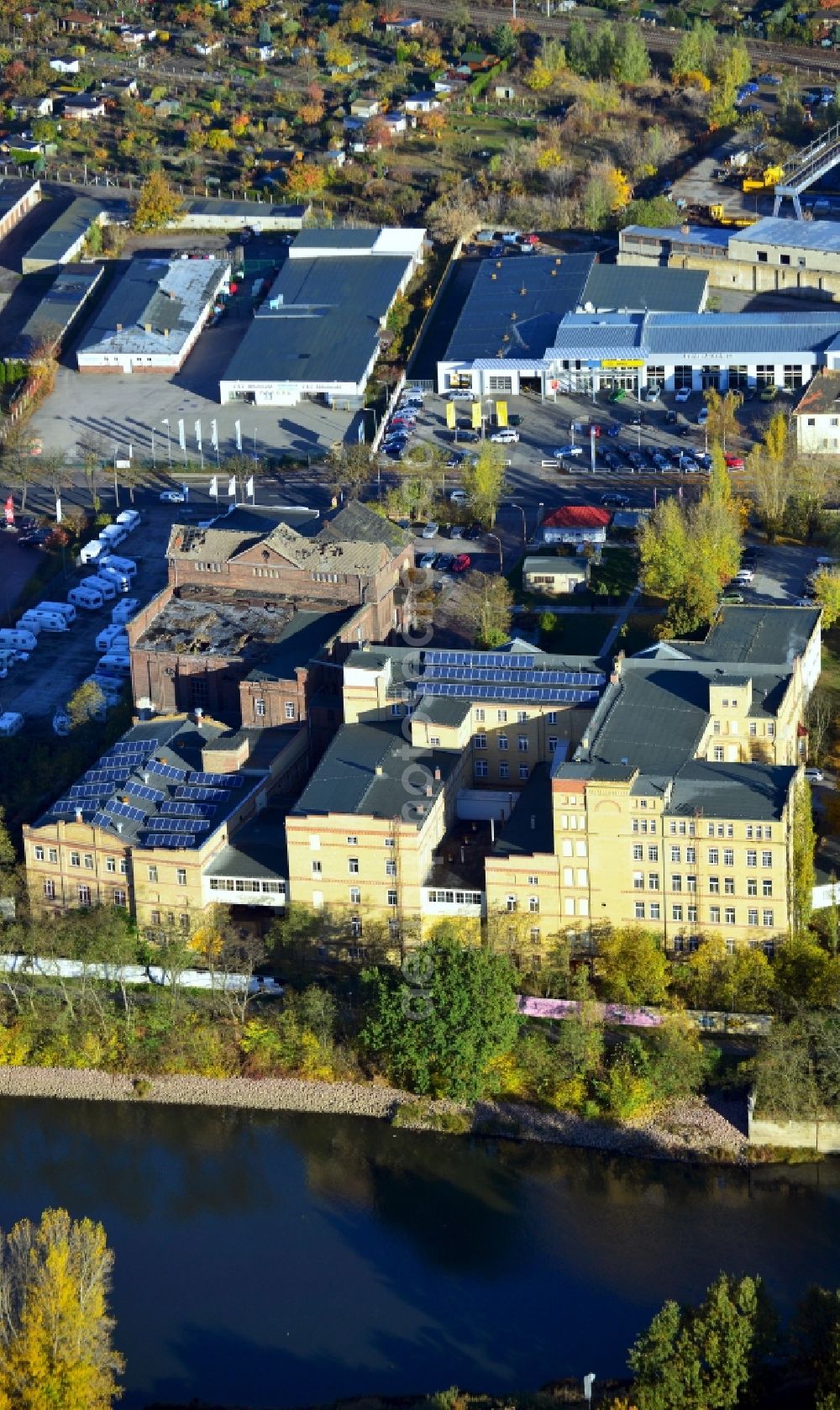 Aerial image Lutherstadt Wittenberg - View of a factory and office building on the banks of the Elbe in Saxony-Anhalt