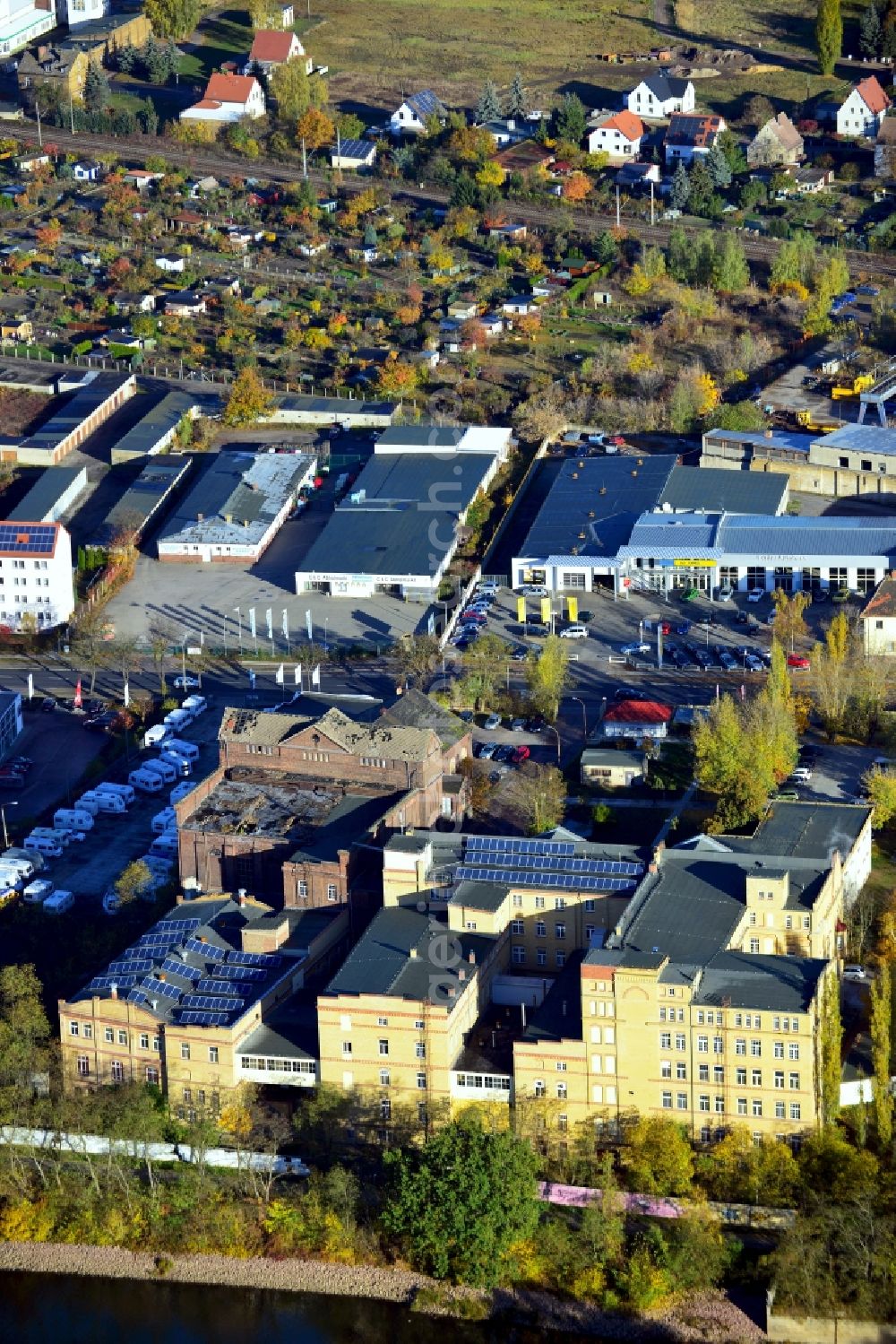 Lutherstadt Wittenberg from above - View of a factory and office building on the banks of the Elbe in Saxony-Anhalt