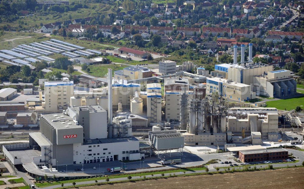 Staßfurt from the bird's eye view: Factory premises of the waste incinerating facility of the EVZA GmbH and the Sodawerk Staßfurt in Saxony-Anhalt. EVZA is a company for the treatment of residual waste for energy generation, e.g. for steam and electricity production. The Sodawerk for the manufaturing of soda is operated by the Sodawerk Staßfurt GmbH & Co. KG