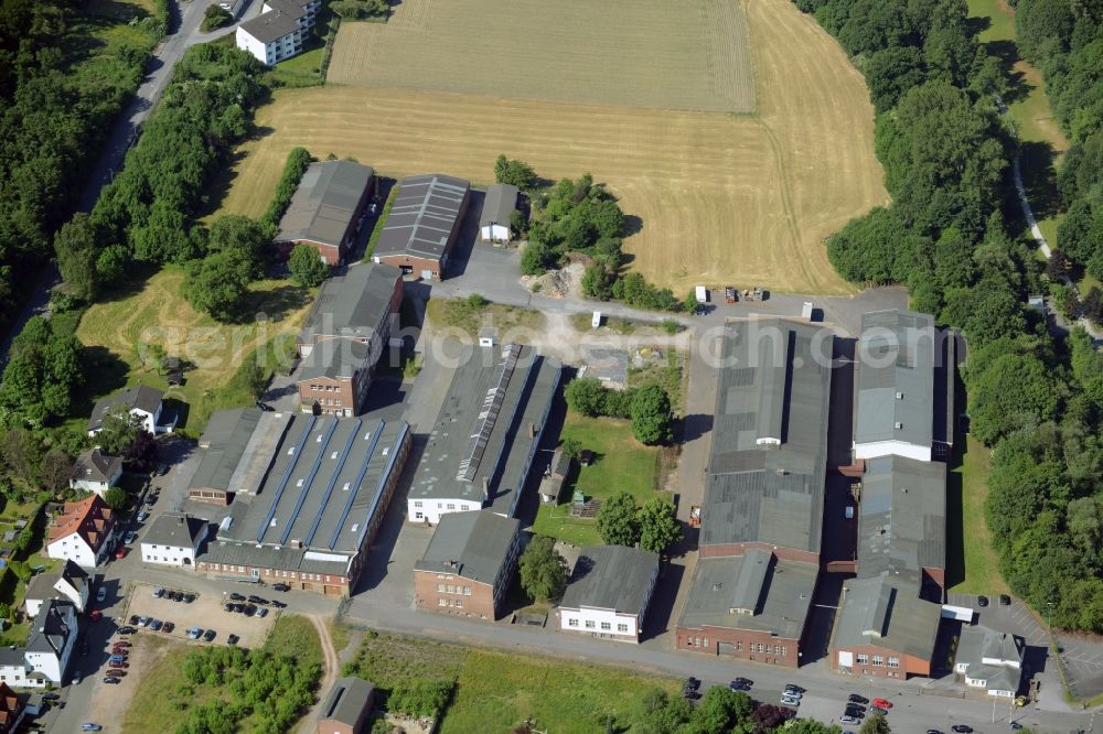 Menden (Sauerland) from above - Factory on Baufastrasse in Menden (Sauerland) in the state of North Rhine-Westphalia. The partly historic compound includes events locations and clubs