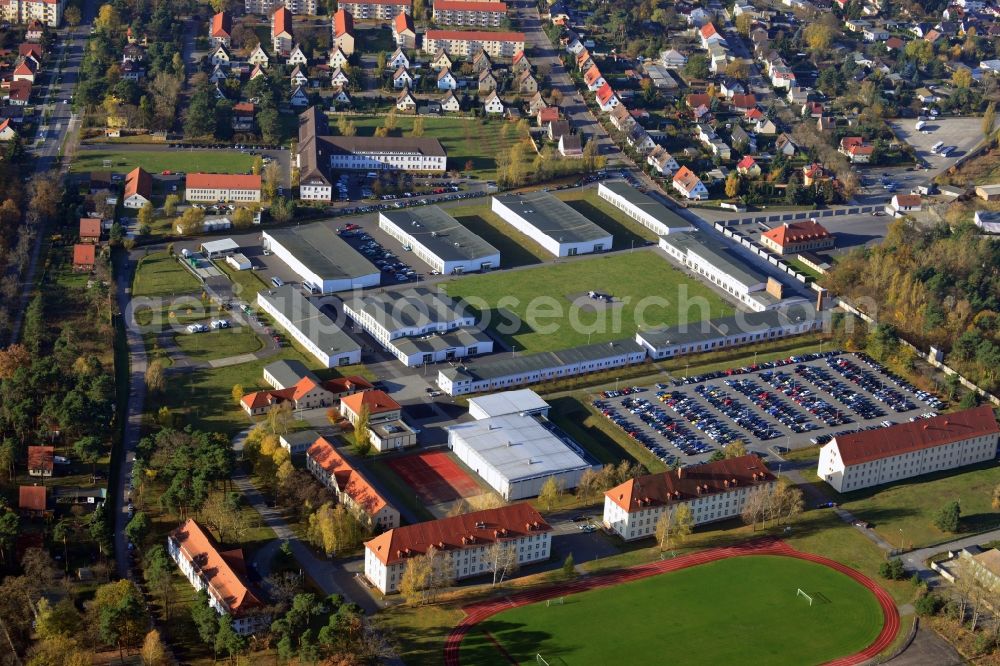 Oranienburg from the bird's eye view: Overlooking the grounds of the Police College of the State of Brandenburg ( FHPol ) at Bernauer Strasse and the former SS administration building for the Inspectorate of the Concentration Camps in Oranienburg. The former SS administration building at the Heinrich Gruber Square served the Nazis as the site of the bureaucratic planning and coordination of the conditions in many concentration camps. Today the premises are used by the Brandenburg Memorials Foundation and the IRS Oranienburg