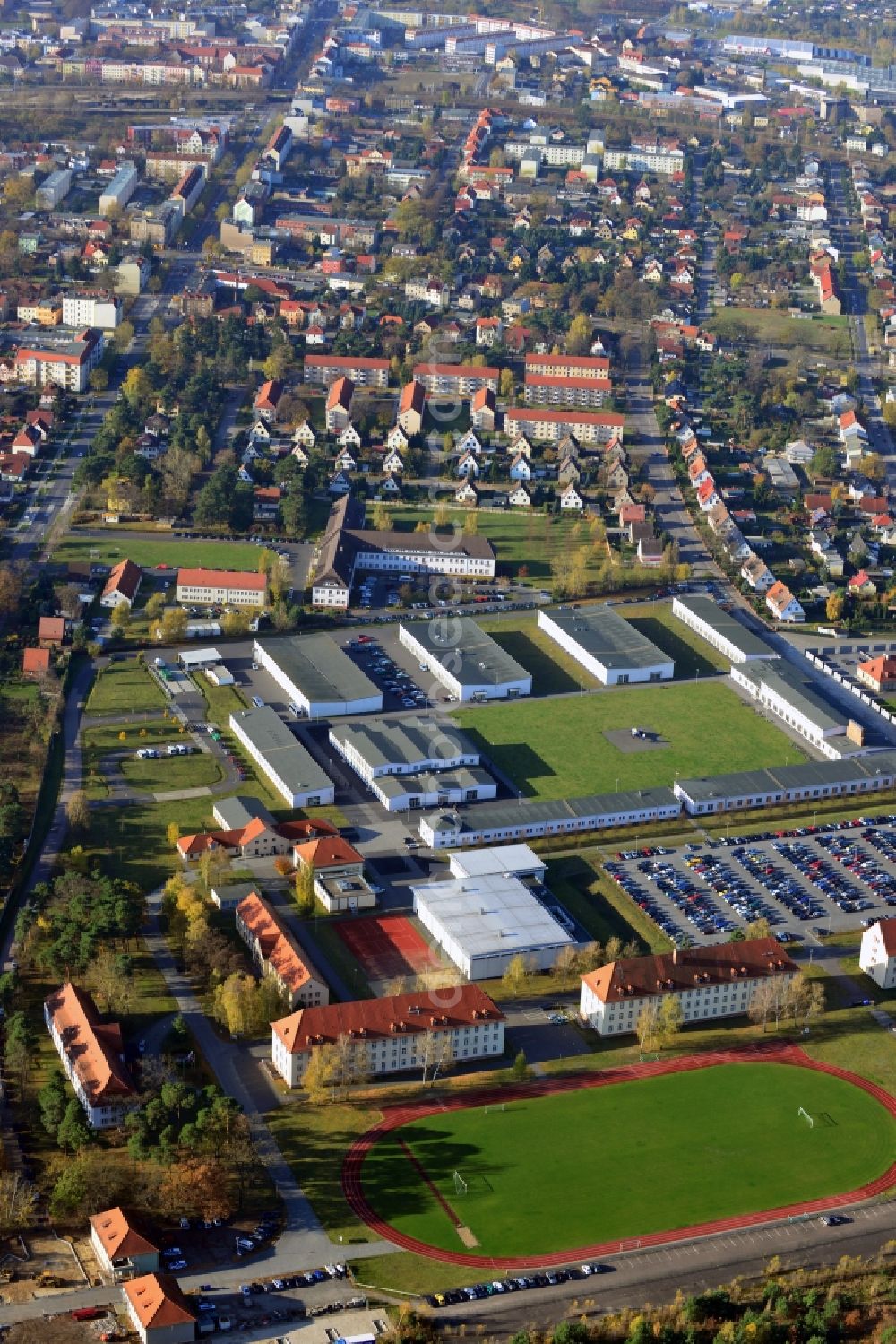 Aerial image Oranienburg - Overlooking the grounds of the Police College of the State of Brandenburg ( FHPol ) at Bernauer Strasse and the former SS administration building for the Inspectorate of the Concentration Camps in Oranienburg. The former SS administration building at the Heinrich Gruber Square served the Nazis as the site of the bureaucratic planning and coordination of the conditions in many concentration camps. Today the premises are used by the Brandenburg Memorials Foundation and the IRS Oranienburg