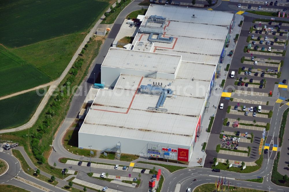 Aerial photograph Würzburg - Shopping centre B19 in Wuerzburg in the state of Bavaria. The shopping centre includes shopping facilities and malls of large chains such as convenience and furniture stores, children and animals stores. The centre is located on the federal highway B19, next to IKEA