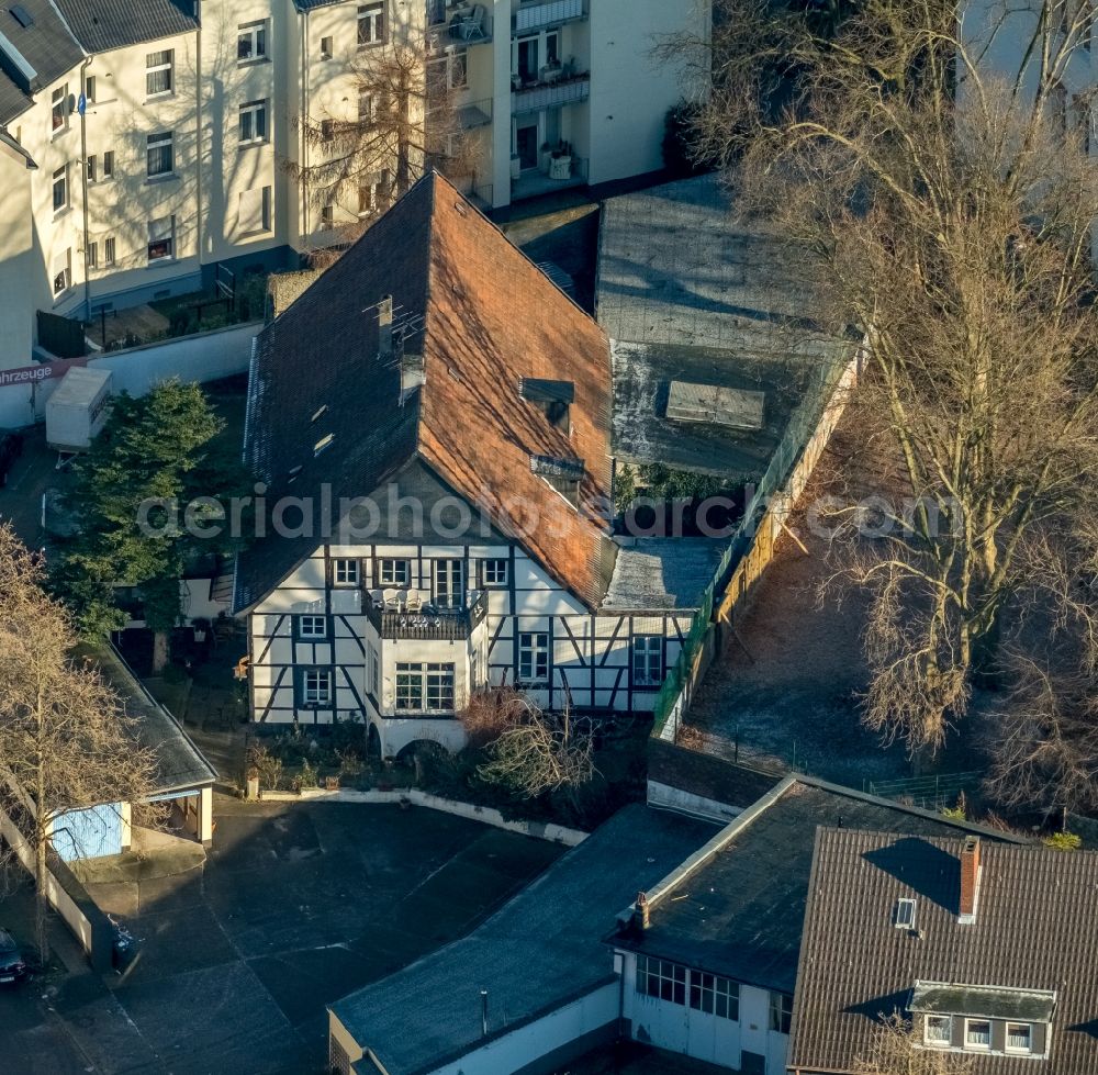 Bochum from the bird's eye view: Half-timbered house and block of flats in the district of Wattenscheid in Bochum in the federal state North Rhine-Westphalia