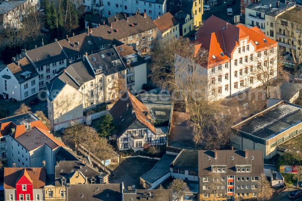 Bochum from the bird's eye view: Half-timbered house and block of flats in the district of Wattenscheid in Bochum in the federal state North Rhine-Westphalia