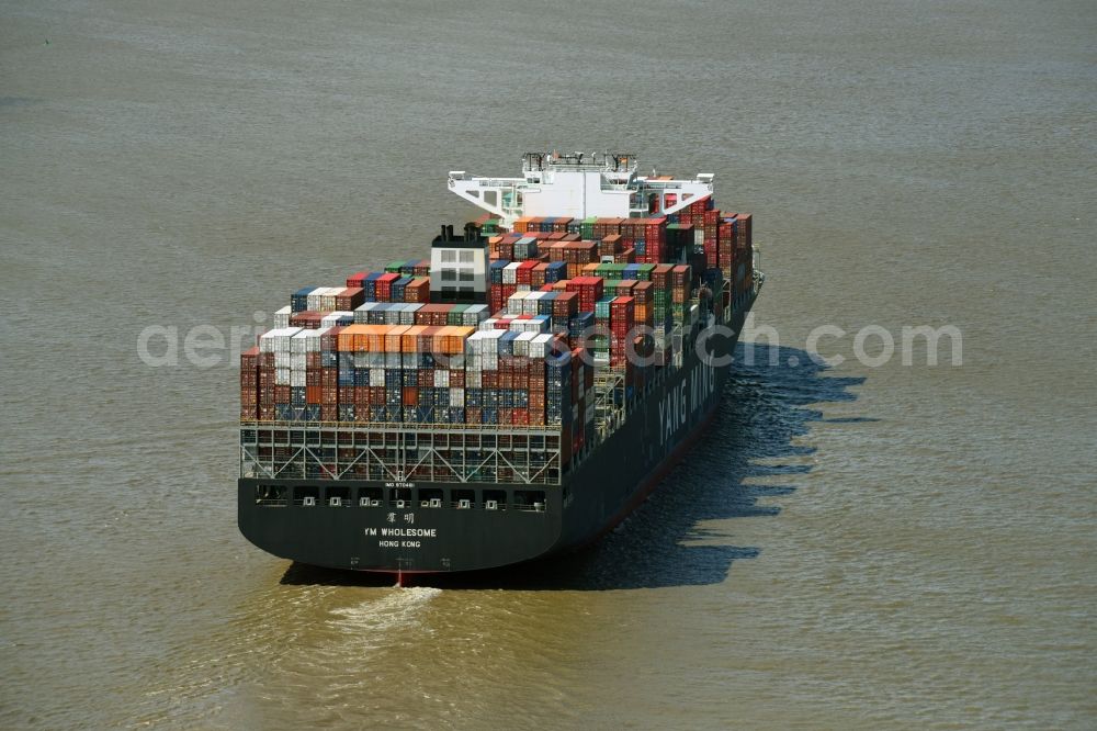 Bützfleth from above - Sailing container ship YANG MING on river Elbe near Buetzfleth in the state Lower Saxony, Germany