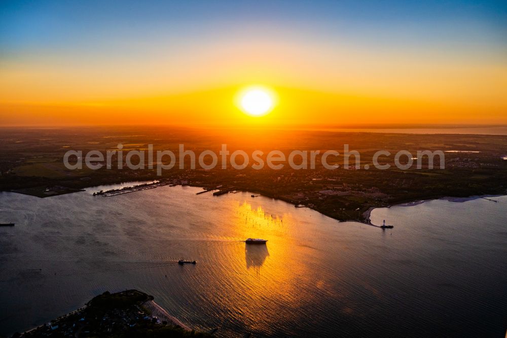 Kiel from above - Moving cruise ship in the sunset on the Kiel Fjord in Kiel in the state Schleswig-Holstein, Germany