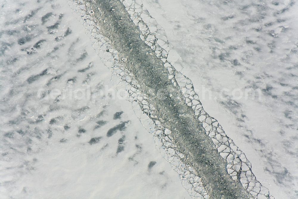 Aerial image Rügen - Im harten Winter 2009/2010 war es schwierig, die Fahrrinne zwischen Rügen und dem Festland schiffbar zu halten. Kurze Zeit nachdem der Eisbrecher seine Arbeit getan hatte, drohte die Fahrrinne bereits wieder zuzufrieren.