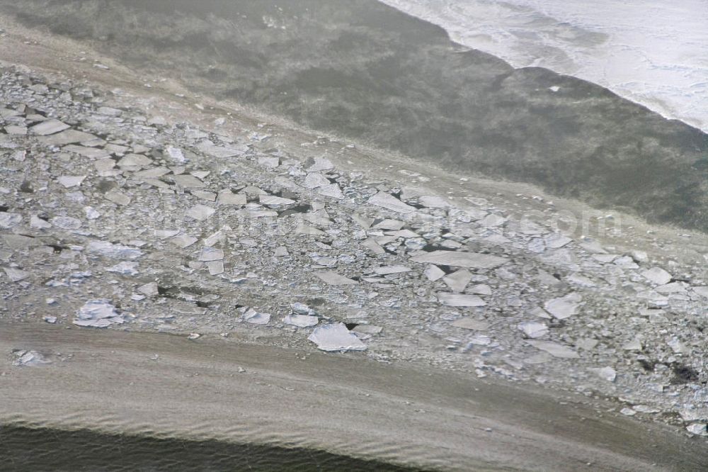 Aerial photograph Rügen - Im harten Winter 2009/2010 war es schwierig, die Fahrrinne zwischen Rügen und dem Festland schiffbar zu halten. Kurze Zeit nachdem der Eisbrecher seine Arbeit getan hatte, drohte die Fahrrinne bereits wieder zuzufrieren.