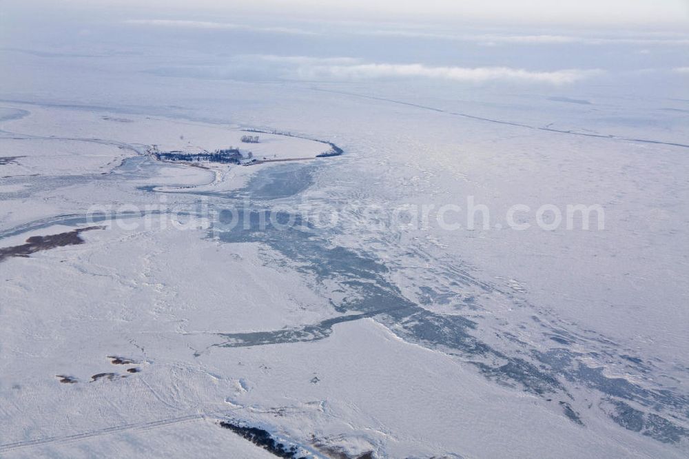 Rügen from above - Im harten Winter 2009/2010 War es schwierig, die Fahrrinne zwischen Rügen und dem Festland schiffbar zu halten. Kurze Zeit nachdem der Eisbrecher seine arbeit getan hatte, drohte die Fahrrinne bereits wieder zuzufrieren.