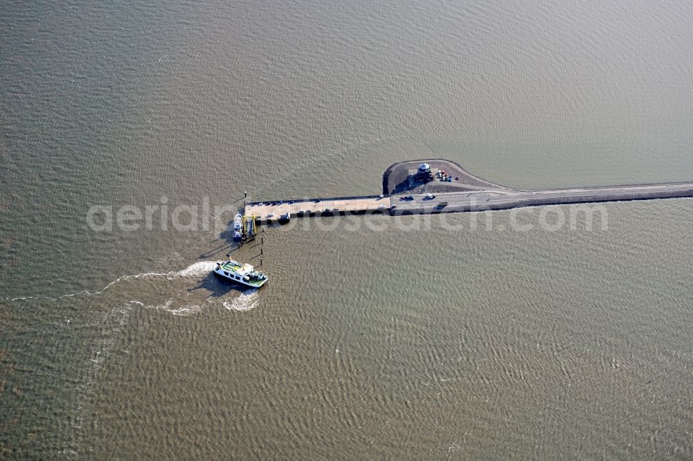 Pellworm from above - Ride of a ferry ship at the landing stage Ostersiel on island Pellworm in the state Schleswig-Holstein