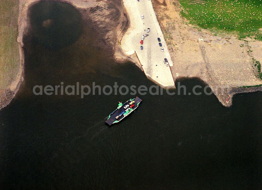 Rheinberg from above - Ride a ferry ship on the banks of the Rhine in Rheinberg in the state North Rhine-Westphalia