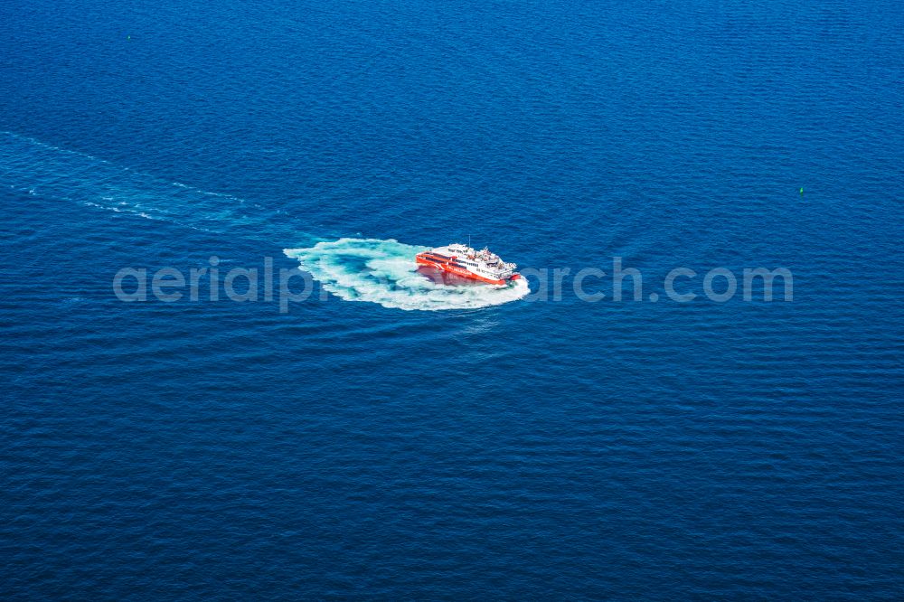 Helgoland from the bird's eye view: Trip of a ferry ship FRS Halunder Jet in Heligoland in the state Schleswig-Holstein, Germany