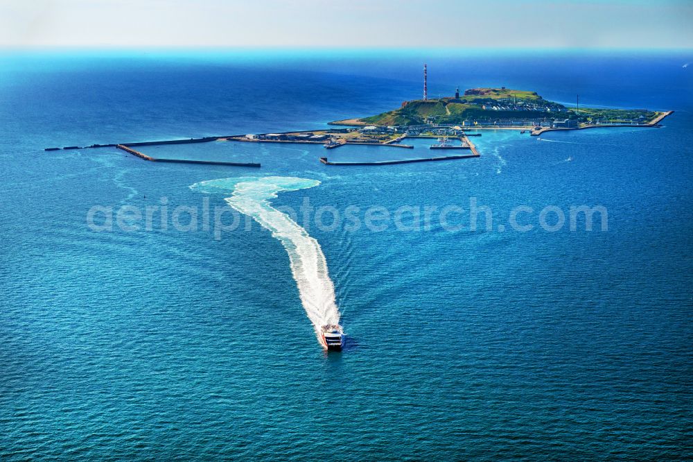 Helgoland from the bird's eye view: Trip of a ferry ship FRS Halunder Jet in Heligoland in the state Schleswig-Holstein, Germany