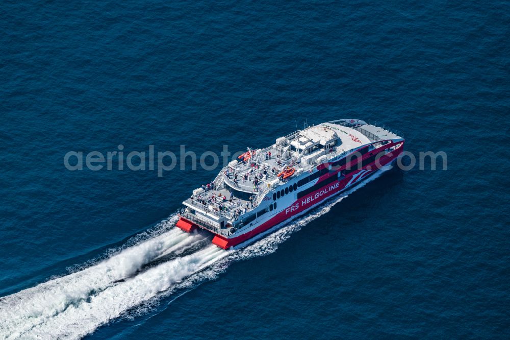 Helgoland from the bird's eye view: Journey of the ferry ship FRS Halunderjet over the North Sea off Heligoland in the state of Schleswig Holstein