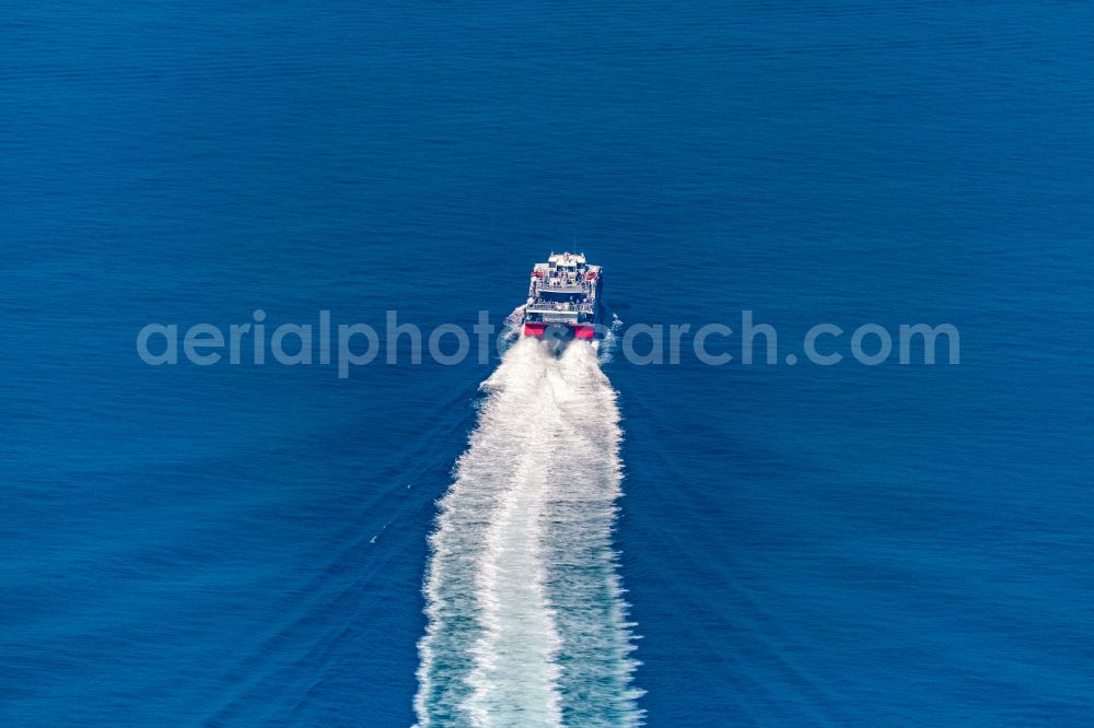 Helgoland from the bird's eye view: Journey of the ferry ship FRS Halunderjet over the North Sea off Heligoland in the state of Schleswig Holstein