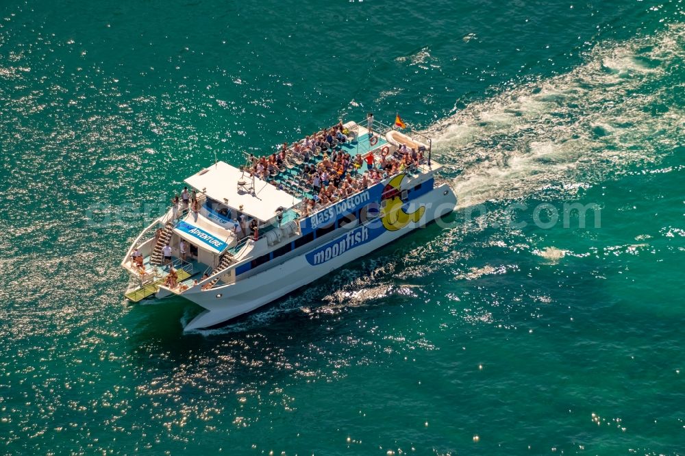 Aerial image Porto Cristo - Ride a ferry ship of Katamaran with Glasboden moonfish in Porto Cristo in Balearic islands, Spain