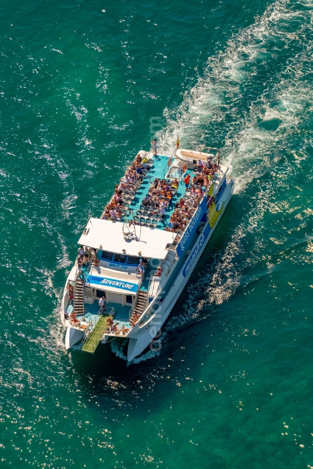 Porto Cristo from the bird's eye view: Ride a ferry ship of Katamaran with Glasboden moonfish in Porto Cristo in Balearic islands, Spain