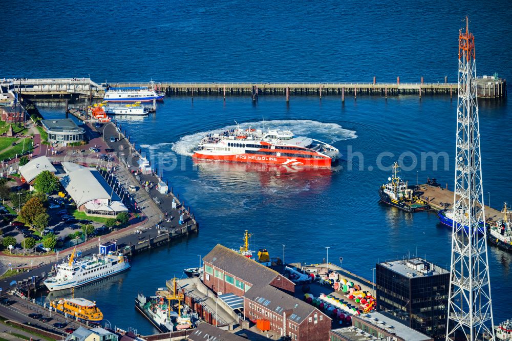 Cuxhaven from above - Travel of a ferry ship Katamaran Halunder Jet der FRS Reederei in Cuxhaven habour in the state Lower Saxony, Germany