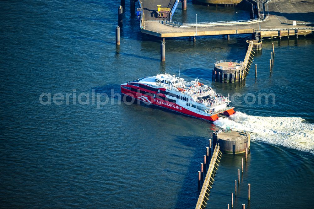 Aerial image Cuxhaven - Travel of a ferry ship Katamaran Halunder Jet der FRS Reederei in Cuxhaven habour in the state Lower Saxony, Germany