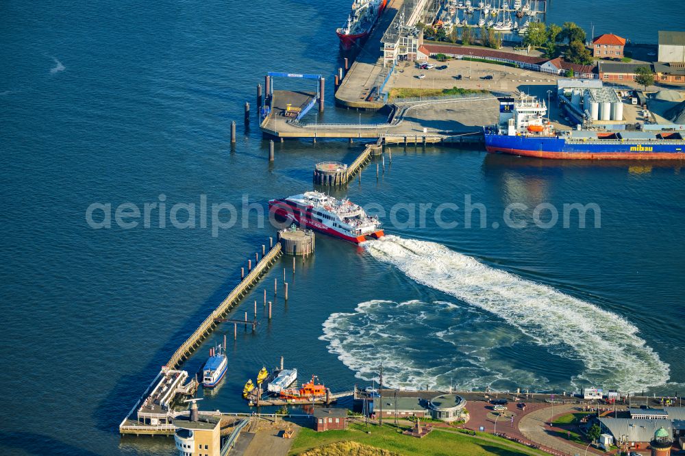 Cuxhaven from above - Travel of a ferry ship Katamaran Halunder Jet der FRS Reederei in Cuxhaven habour in the state Lower Saxony, Germany