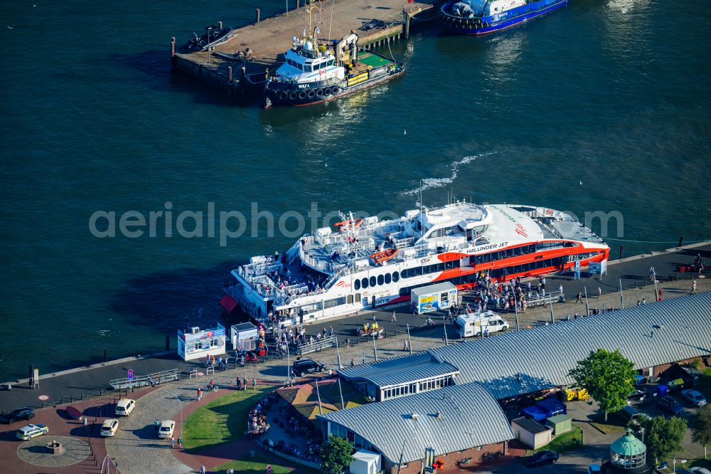 Cuxhaven from above - Travel of a ferry ship Katamaran Halunder Jet der FRS Reederei in Cuxhaven habour in the state Lower Saxony, Germany