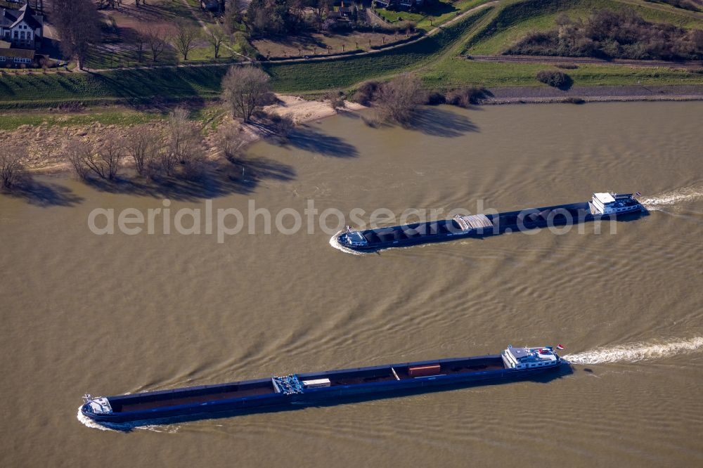 Orsoy from above - Ride a ferry ship and eines Schuettgutfrachters on Rhein in Orsoy in the state North Rhine-Westphalia, Germany