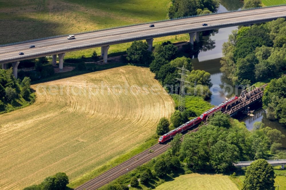 Aerial photograph Arnsberg - Ride a train on the track of Regional Express in the district Rumbeck in Arnsberg in the state North Rhine-Westphalia, Germany