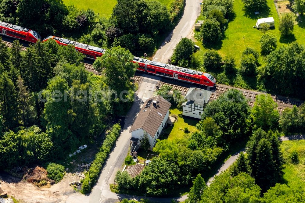 Arnsberg from above - Ride a train on the track of Regional Express in the district Rumbeck in Arnsberg in the state North Rhine-Westphalia, Germany