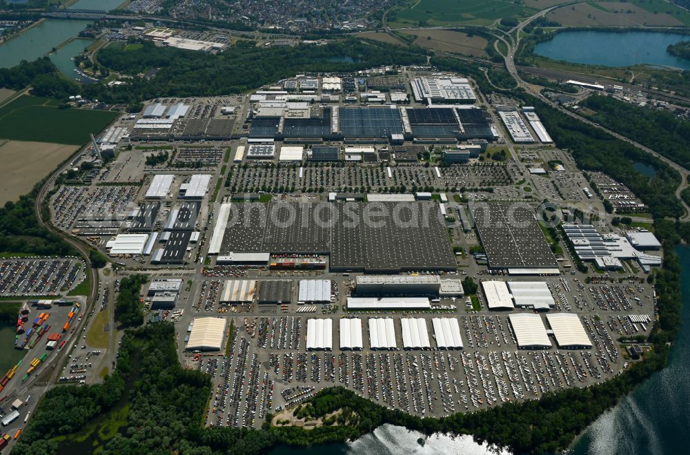 Wörth am Rhein from above - Buildings and production halls on the vehicle construction site and parking spaces for new vehicles in Woerth am Rhein in the state Rhineland-Palatinate, Germany