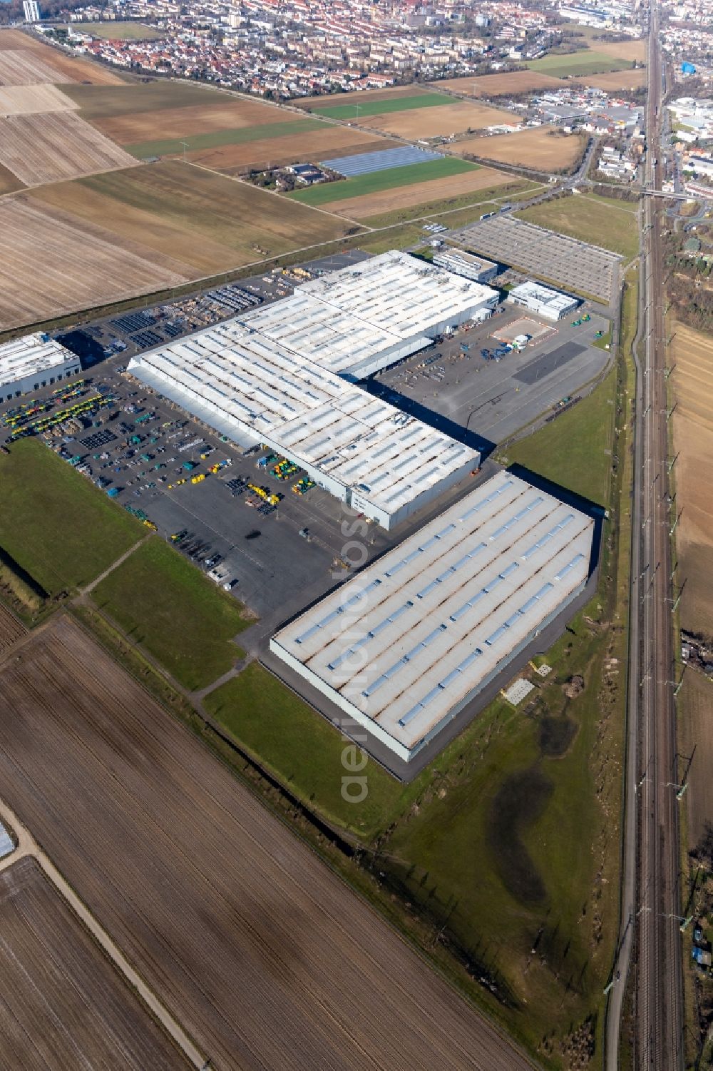 Ludwigshafen am Rhein from the bird's eye view: Buildings and production halls on the vehicle construction site of Joseph Voegele AG in the district Rheingoenheim in Ludwigshafen am Rhein in the state Rhineland-Palatinate, Germany