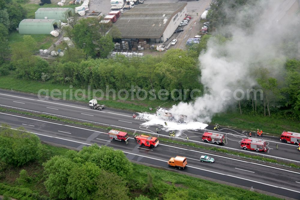 Neuenburg am Rhein from the bird's eye view: On the highway A5 near Neuenburg burns a garbage truck