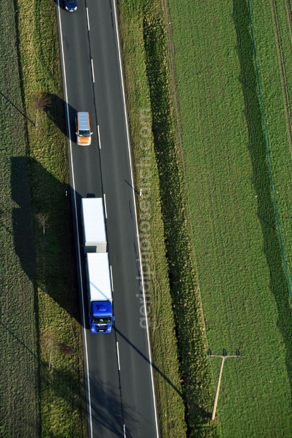 Aerial photograph Krostitz - Motor vehicles in traffic along the Landstrasse S4 in Krostitz in the state Saxony