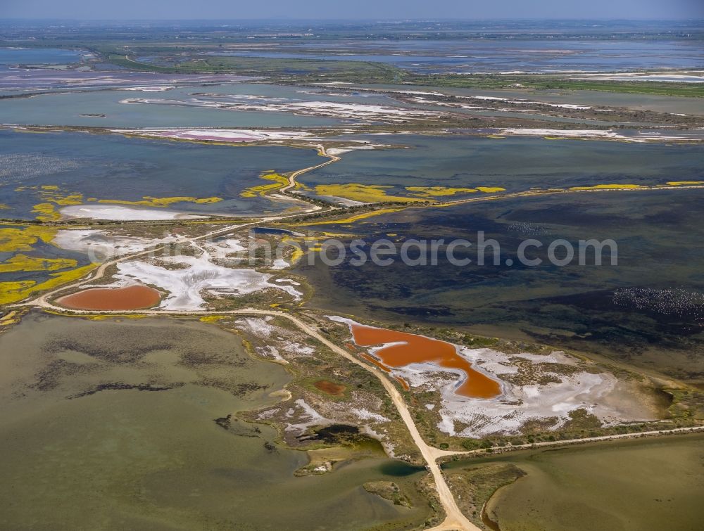 Saintes-Maries-de-la-Mer from above - Colored Salinen- landscape in Saintes-Maries-de-la-Mer in France