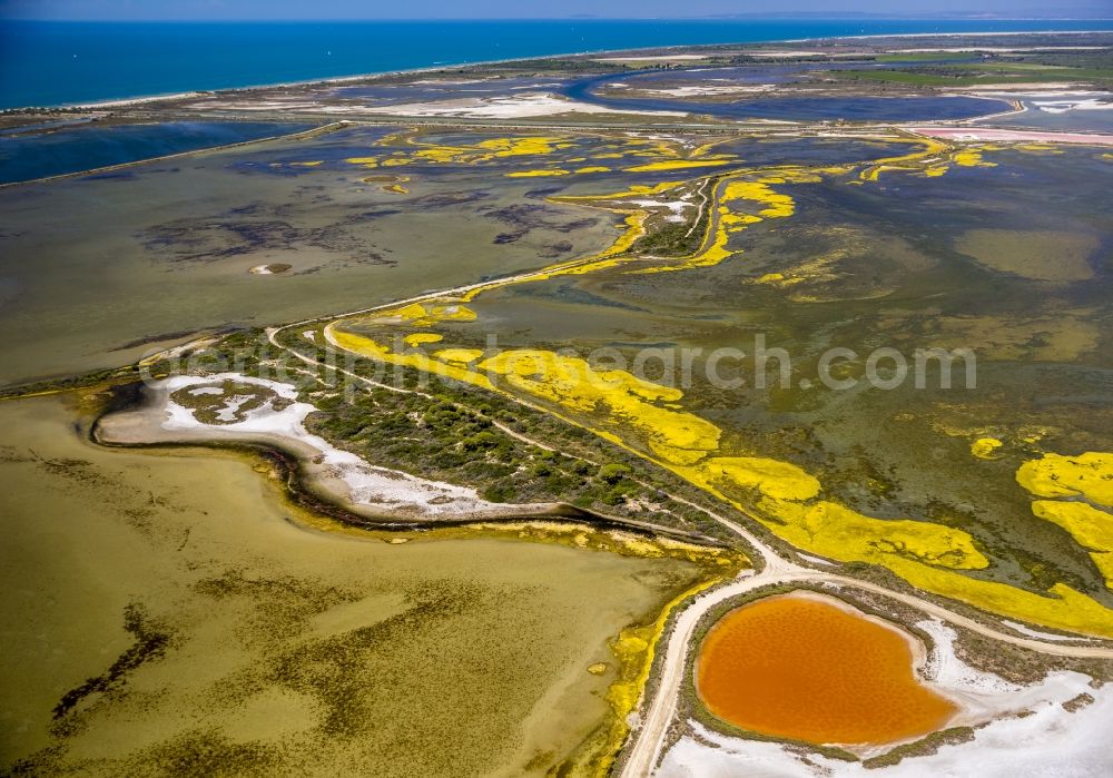 Saintes-Maries-de-la-Mer from above - Colored Salinen- landscape in Saintes-Maries-de-la-Mer in France