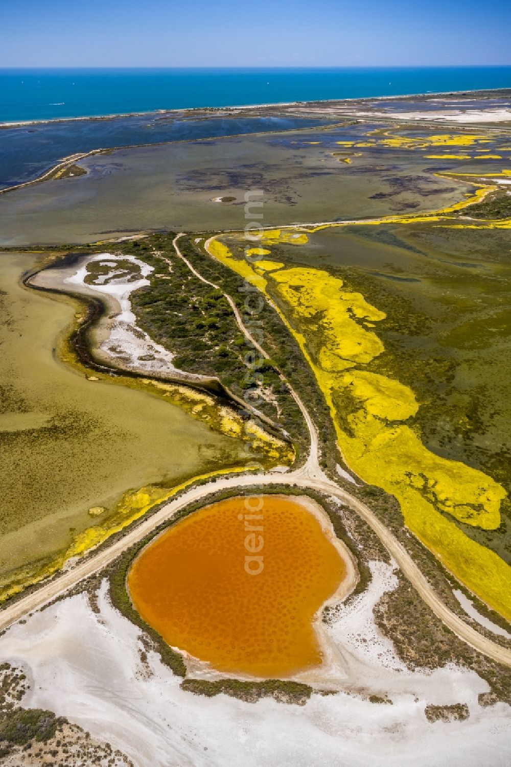 Aerial photograph Saintes-Maries-de-la-Mer - Colored Salinen- landscape in Saintes-Maries-de-la-Mer in France