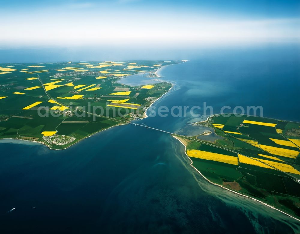 Aerial image Fehmarn - Fehmarnsund and Fehmarndsund Bridge in Fehmarn in the state of Schleswig-Holstein. The Fehmarn Sound is the small ocean canal of the Baltic Sea that seperates the island of Fehmarn from the mainland. The Fehmarn Sound Bridge was opened in 1963 and is part of the so-called Vogelfluglinie (literally bird flight line) from Hamburg to Copenhagen