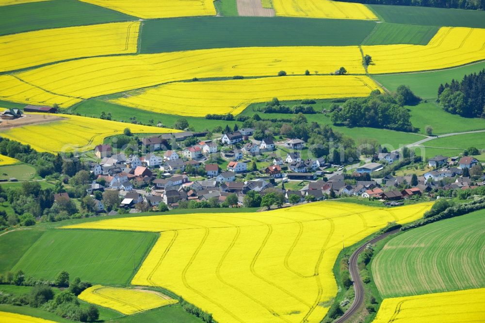 Aerial photograph Grävenwiesbach - Field landscape yellow flowering rapeseed flowers in Graevenwiesbach in the state Hesse