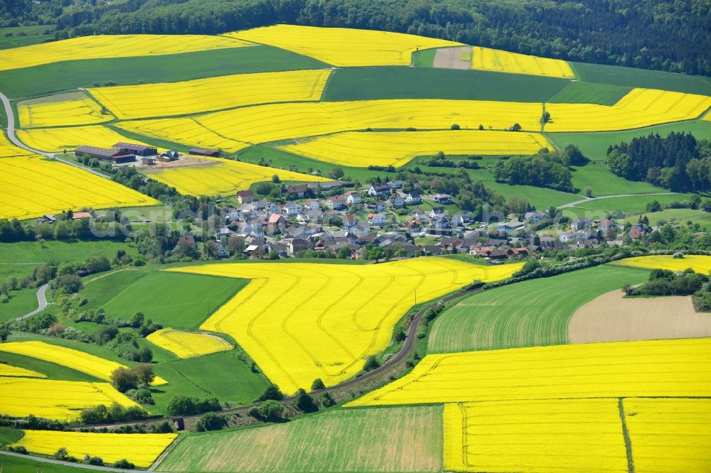 Aerial photograph Grävenwiesbach - Field landscape yellow flowering rapeseed flowers in Graevenwiesbach in the state Hesse